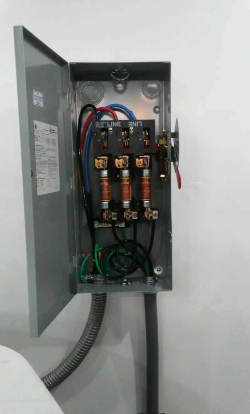 Three-phase disconnect switch installed for Smoke Detector Installation in Brush