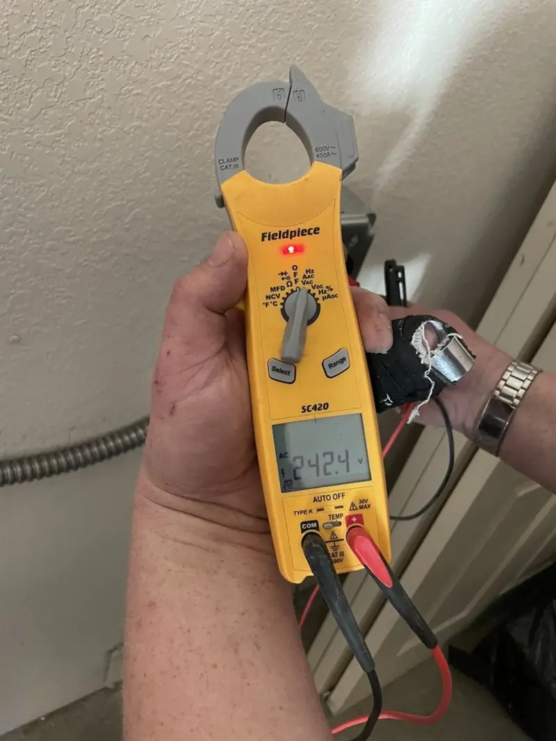 Voltage testing with clamp meter during Generator Installation in Brush